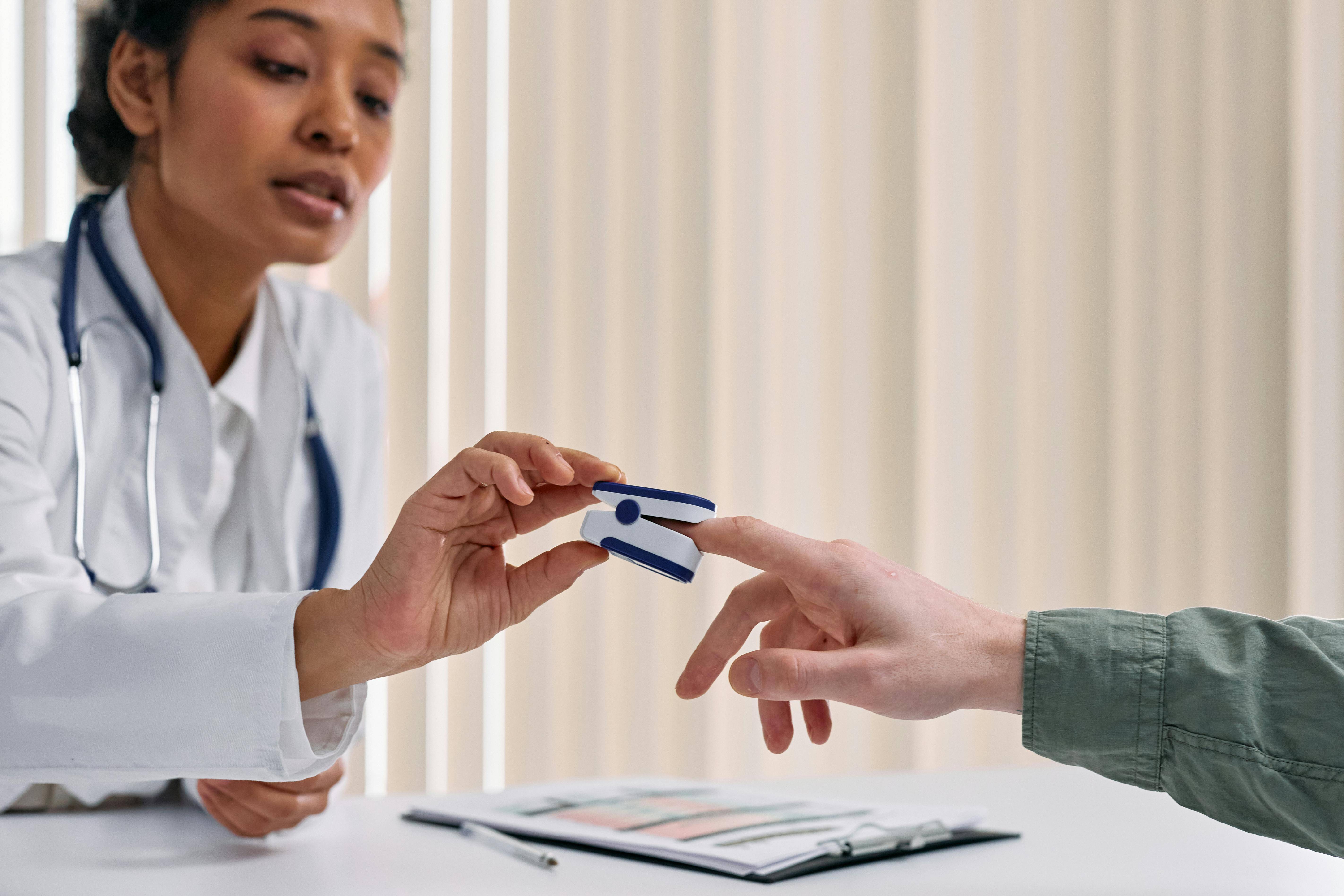 Doctor checking heart rate