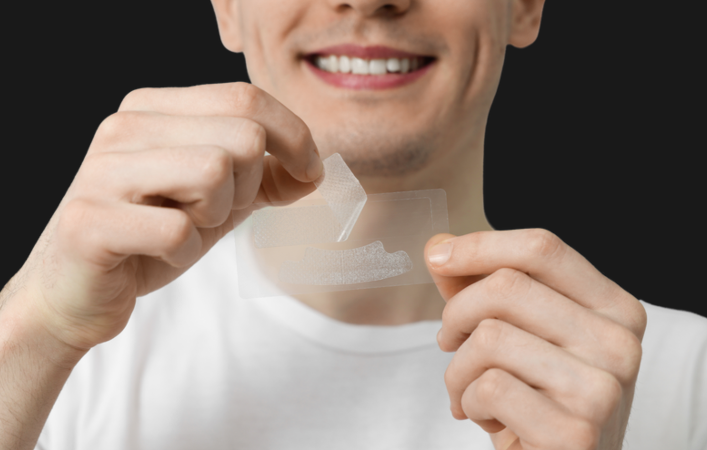 Person with whitening strips